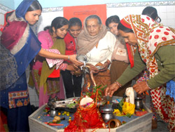 Devotees offering milk to a shivling at a temple on the occasion of Shivratri in Bathinda on Monday.
