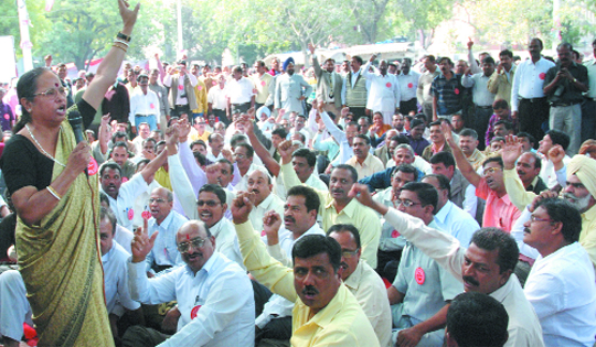 Members of the All India Federation of University and College Teachers hold a sit-in at Jantar Mantar in New Delhi