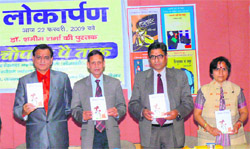 Rajbir Deswal, DIG (CID), Haryana (left), releases a book on humour in Hisar.