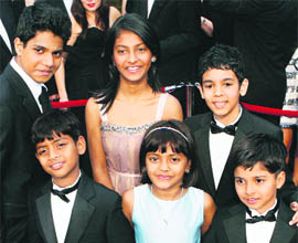 Young actors from ‘Slumdog Millionaire’ (front row L-R) Azharuddin Mohammed Ismail, Rubina Ali, Ayush Manesh Khedekar, (back row L-R) Ashotosh Lobo Gajiwala, Tangi Ganesh Lonkar and Tanay Hermant Chheda arrive at the 81st Academy Awards in Hollywood.