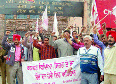 Students protest in front of Jallianwala Bagh Memorial in Amritsar on Monday.