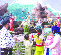 Devotees visit Devi Talab Mandir on the occasion of Mahashivratri in Jalandhar on Monday.