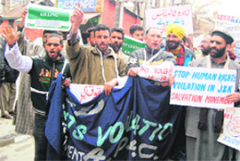 Activists of the Jammu Kashmir Salvation Movement shout slogans during a demonstration in protest against human rights violations in Srinagar on Monday.