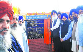 Ajmer Singh Lakhowal, Chairman, Punjab Mandi Board, lays the foundation stone of a link road.