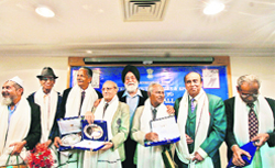 Sports Minister M S Gill poses with the Heroes of the 1956 Olympic Indian football team during a felicitation function in New Delhi 