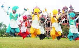Students of Khalsa College perform bhangra during the inauguration of the annual sports meet in Amritsar on Tuesday. 