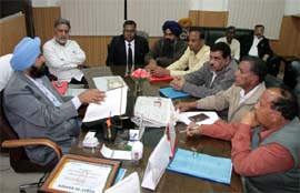 Mayor Baljeet Singh Bir Behman hearing the grievances of the BJP councillors at the office of the Bathinda Municipal Corporation on Tuesday. 