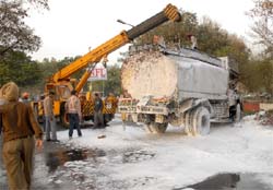 An oil tanker overturned in Bathinda near the NFL Colony on Tuesday. Fire tenders and cranes were rushed to bring the situation under control. No casualty was, however, reported