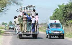 An overloaded commercial vehicle in Jammu.