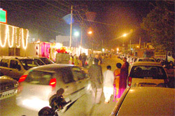 Traffic woes: Cars parked outside Central Green marriage palace on Ladowali Road in Jalandhar create hassles in the traffic movement. 