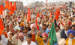CPI-ML activists raising slogans in support of the party candidate during a poll campaign rally near Gol Diggi in Bathinda 