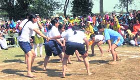 Players in action during a kabaddi tournament at Raikot