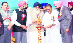 Union Minister for Civil Aviation Praful Patel lights a deepshikha to inaugurate a building at Amritsar International Airport 
