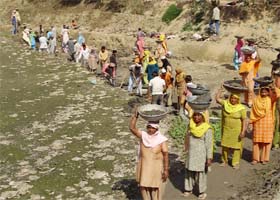 Dalit women doing the job of cleaning the common pond under the NREGA scheme at village Mehna in Moga district