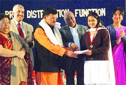 Punjab transport minister Master Mohan Lal gives away a certificate to a student at B.D. Arya Girls College in Jalandhar on Wednesday.