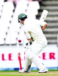 Ricky Ponting looks at his wickets after being bowled by Makaya Ntini (not pictured)