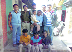 Vicky Sah with his father, after the Nainital police rescued him from the clutches of the kidnappers from Bihar on Friday.