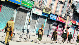 CRPF jawans patrol Srinagar on Sunday to enforce restrictions in view of a protest call given by Syed Ali Shah Geelani over the killing of two youths in Sopore recently.