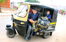 Off to School: An overloaded autorickshaw in Jammu.