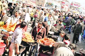 People buy eatables in Srinagar on Saturday after a week marked by violent protests
