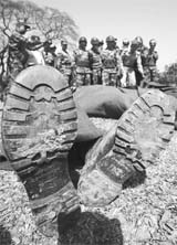 A group of army officials try to recognise the bodies of officers of the Bangladesh Rifles in Dhaka on Saturday. 