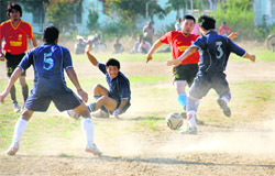 Potala XI and DMK players in action during the final of the 17th Narayan Gurung Memorial Football Tournament in Dehradun on Sunday.