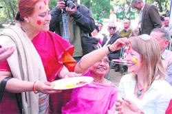 A foreigner being smeared with gulal at a Holi Milan function held by Kurmanchal Sanskritik Parishad at Gandhi Park, Dehradun, on Sunday.