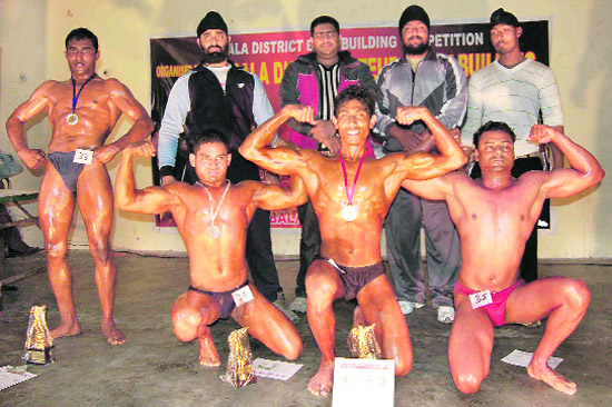 Bodybuilders during the District Bodybuilding Competition in Ambala on Monday.