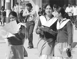 Students come out of an examination centre after taking an exam in Ambala on Monday.