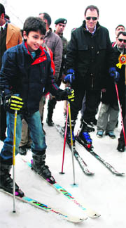 Chief Minister Omar Abdullah and his son enjoy skiiing after the inauguration of the 2nd Annual Gulmarg Global Skiing Derby at Kongdori on Monday. 