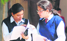 Girls discuss the paper after the first day of the CBSE exams in Ludhiana