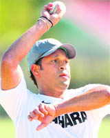 Sachin Tendulkar sends down a delivery during training in Napier on Monday.