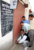 Food and supply officials sealing a ration depot in Bathinda on Tuesday.