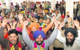 Members of the joint action committee of Punjab and UT employees protest at the Sector-17 plaza in Chandigarh