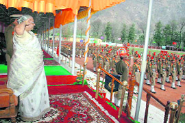 State Governor Prabha Rau taking salute from passing-out trainees at SSB training centre for women, Shamshi, Kullu, on Tuesday.