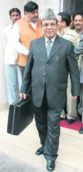 Finance Minister Abdul Rahim Rather reaches the Assembly in Jammu to present the interm budget on Tuesday. 