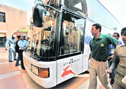 Pak captain Younis Khan looks at the bulletridden bus. 