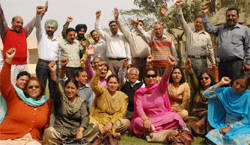 Teachers sit on dharna at DAV College in Bathinda on Wednesday to protest the suspension of three professors in Chandigarh