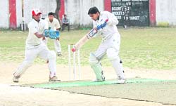 A batsman plays a shot at the 57 District Cricket League at Survey Stadium, Dehradun. 