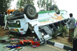 People take a look at the ill-fated bus at Raipur Balla village near Jalandhar on Wednesday