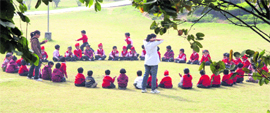 Schoolchildren enjoy an outing at a local park in Ludhiana