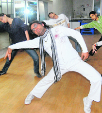 Dev Pathik, with his students performing dance.