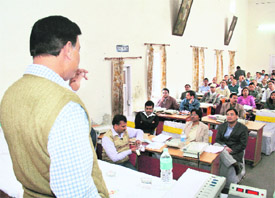 Government officials get training in handling of electronic voting machines in Dehradun on Thursday.