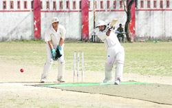 A batsman plays a shot during the 57th District Cricket League.