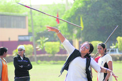 A young girl participates in a javelin throw during the opening ceremony of Annual Athletics Meet at Guru Nanak Dev Engineeting College, Ludhiana, on Thursday.