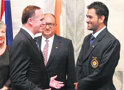 THE KEY TO SUCCESS: MS Dhoni (R) chats with New Zealand Prime Minister John Key (L) as New Zealand Governor General Anand Satyanand (C) looks on in Wellington on Thursday.