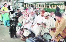 Indian passengers arrive at the Attari Railway Station on Thursday as they return from Pakistan following Tuesdays terrorist attack on the Sri Lankan cricket team in Lahore.