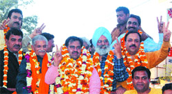 BJP leader Tarun Chug (centre) being greeted by his supporters in Amritsar.