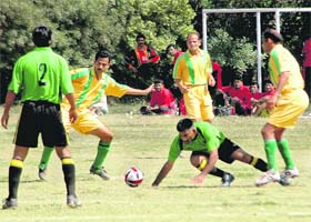 Players in action during a football match between AG Haryana and AG Tamil Nadu at the Sector 17 Football Stadium