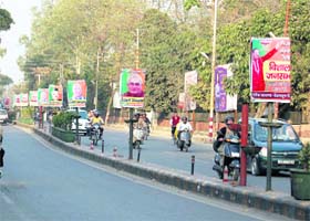 A road plastered with banners and posters for BJPs big show, Sankalp Rally, in Dehradun